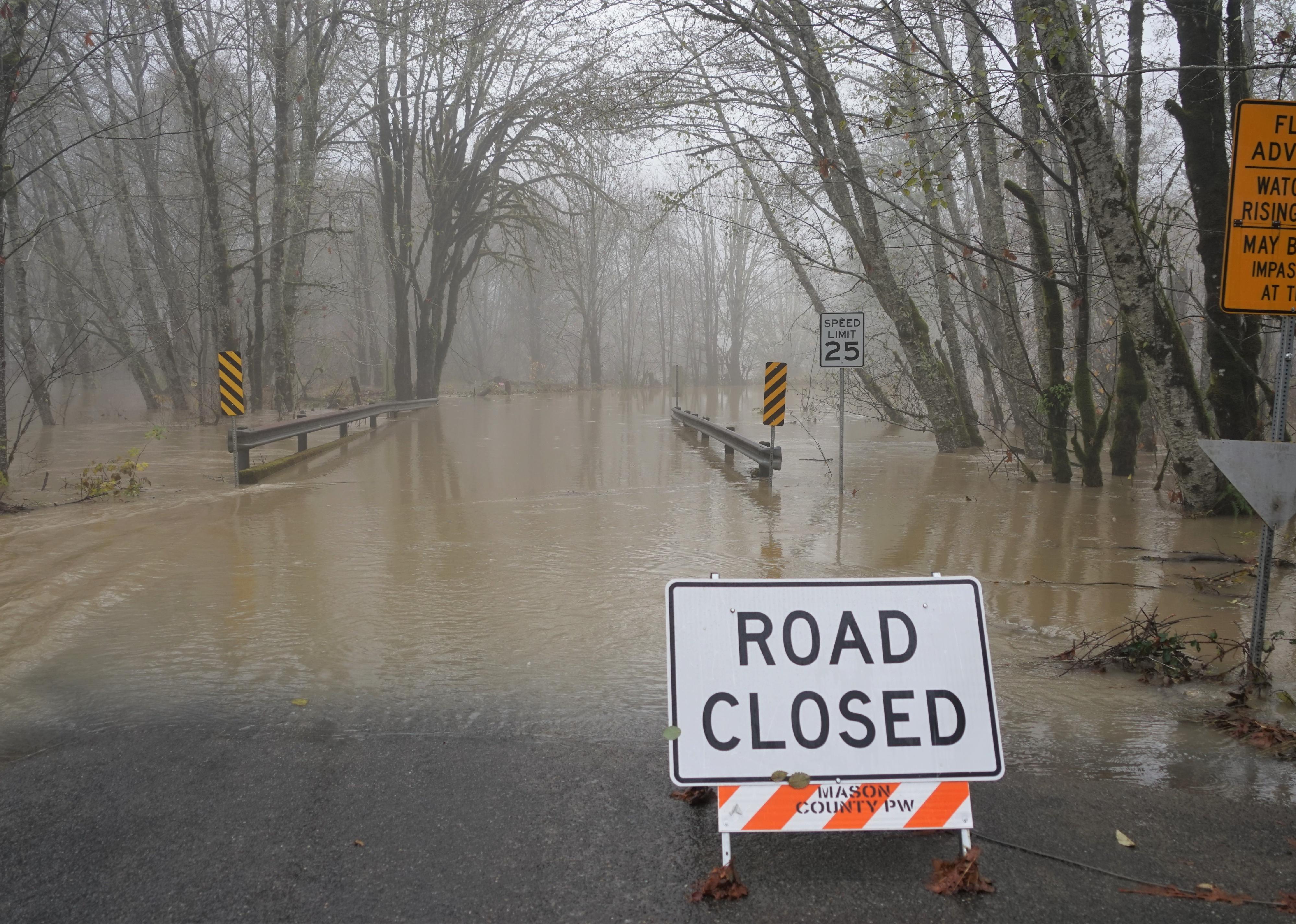Flood zone area and road closed sign.