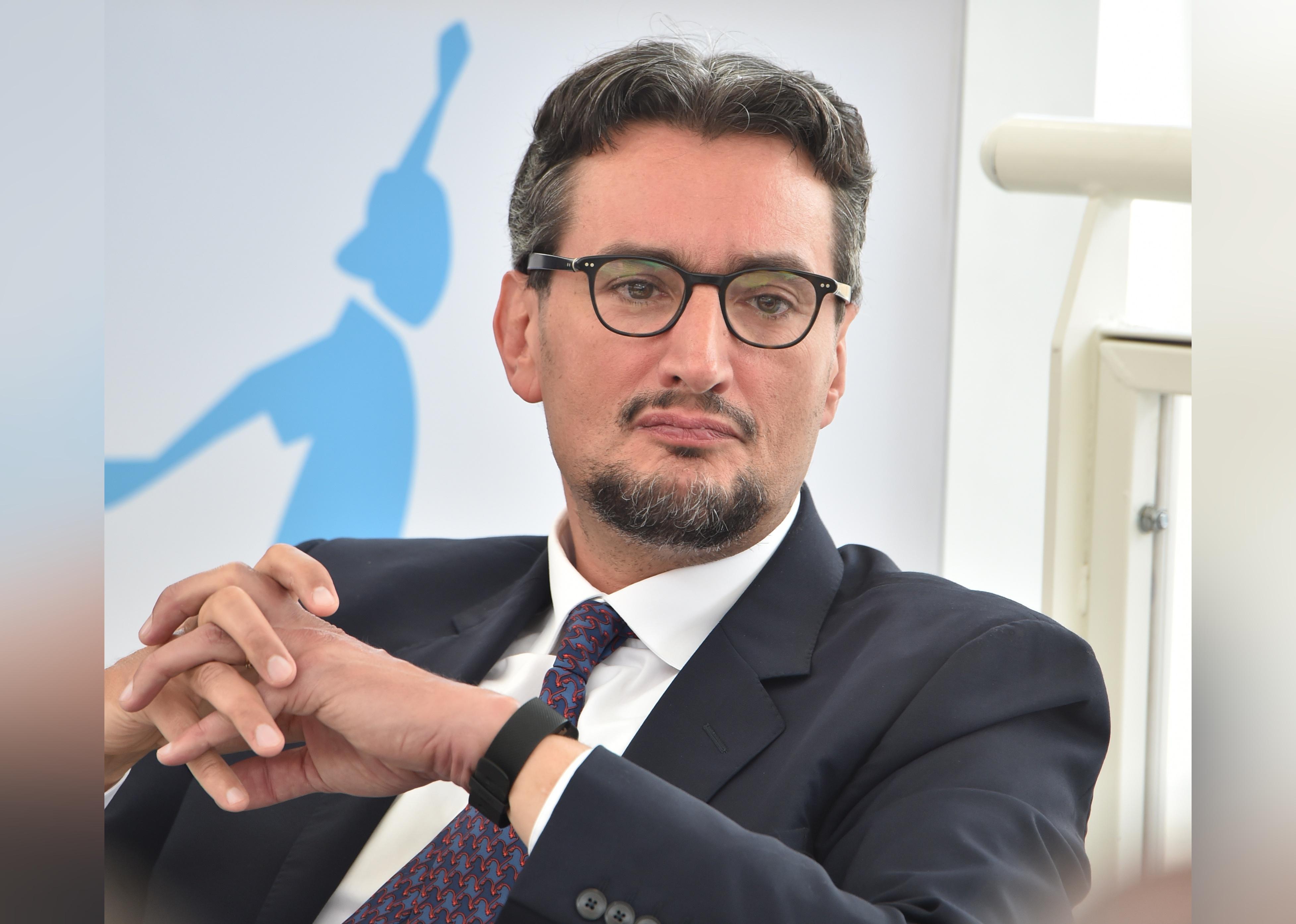Giovanni Ferrero seated.
