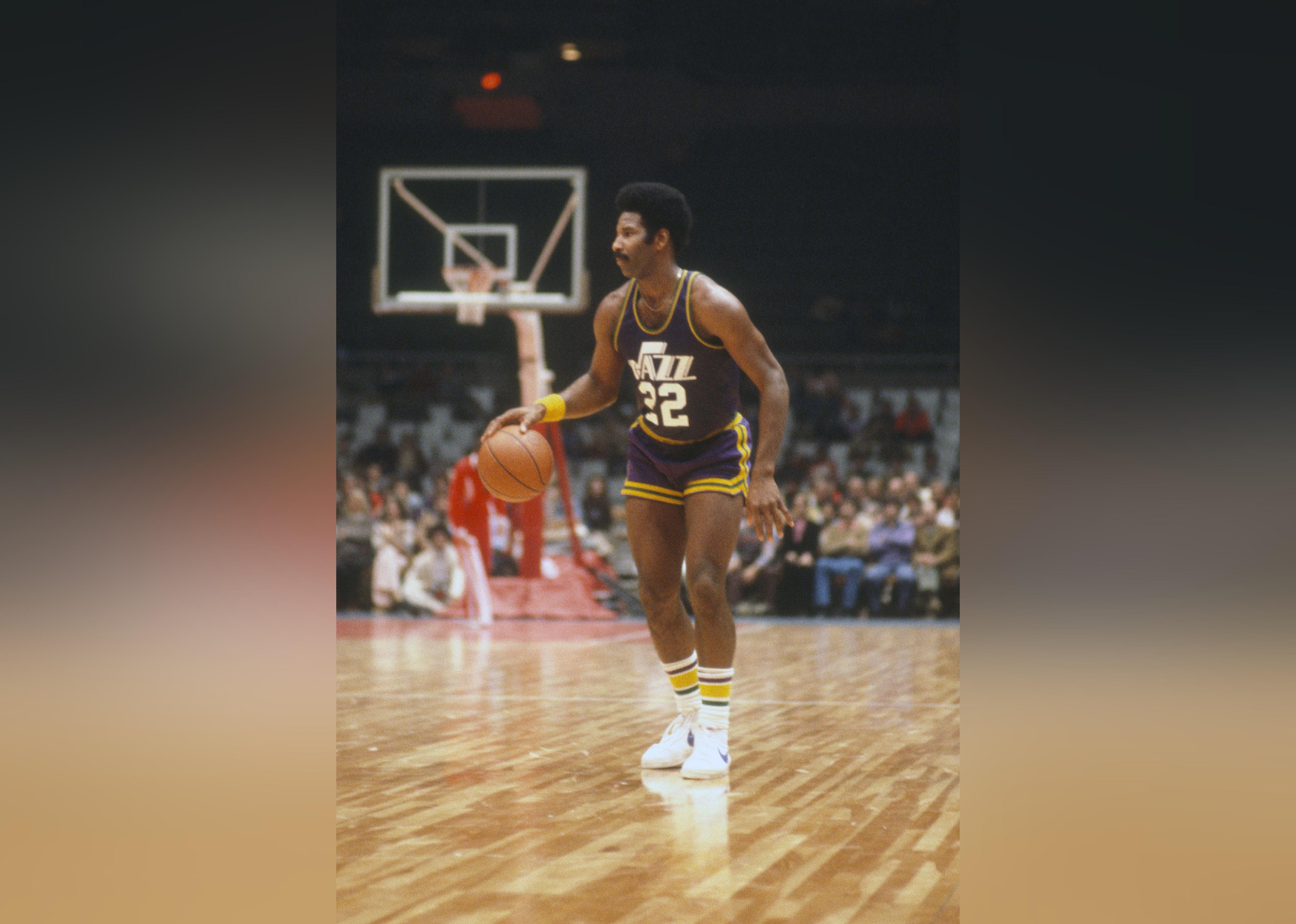 Nate Williams of the New Orleans Jazz dribbles the ball against the New York Net.