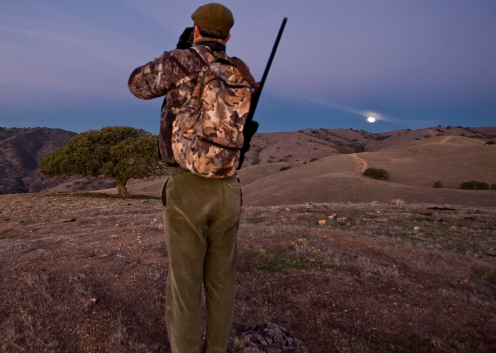 A hunter looking out on a ridge.
