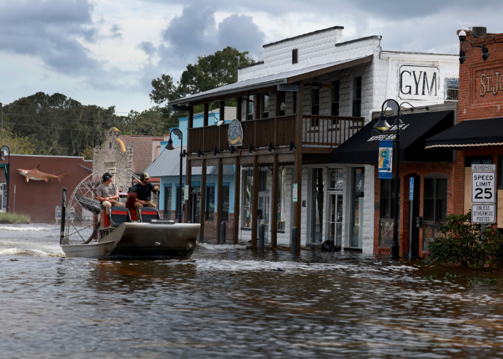 An airboat passes through flood waters in the downtown area after Hurricane Idalia passed offshore on August 30, 2023 in Crystal River, Florida.