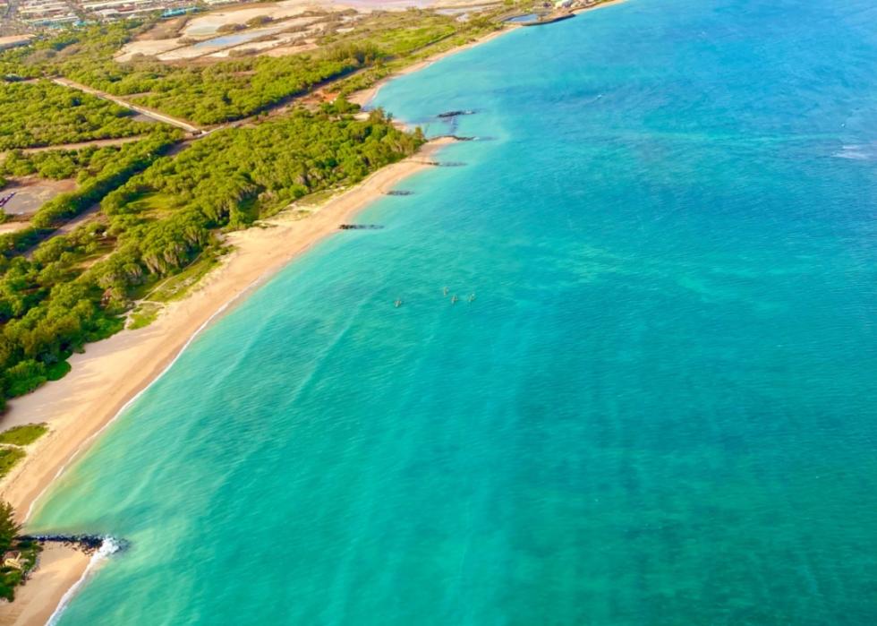 An aerial view of the turquoise water and shoreline.
