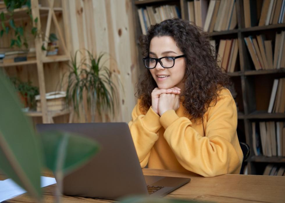 A young woman on a laptop.