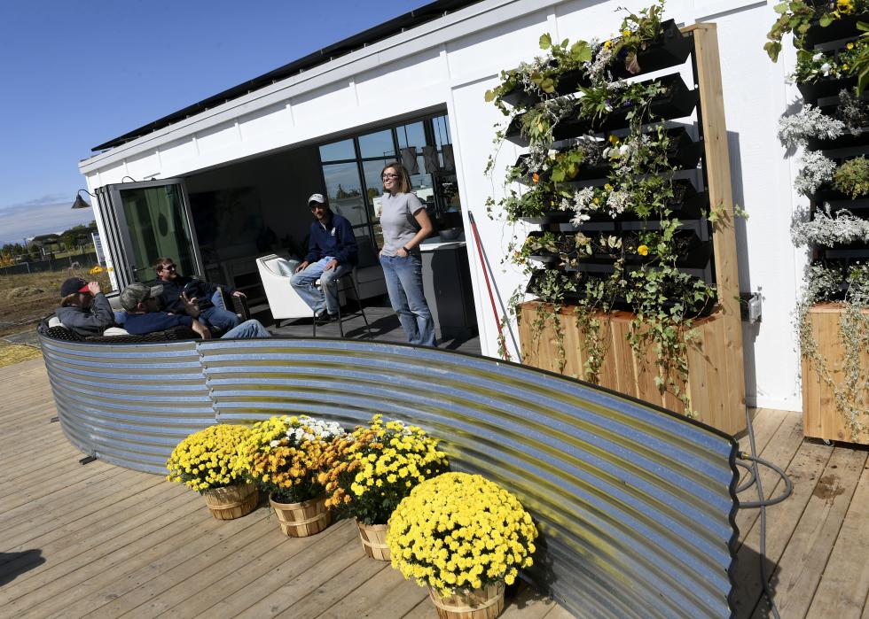 Students from the Missouri University of Science and Technology relax in their almost completed house in preparation for the U.S. Department of Energy Solar Decathlon.