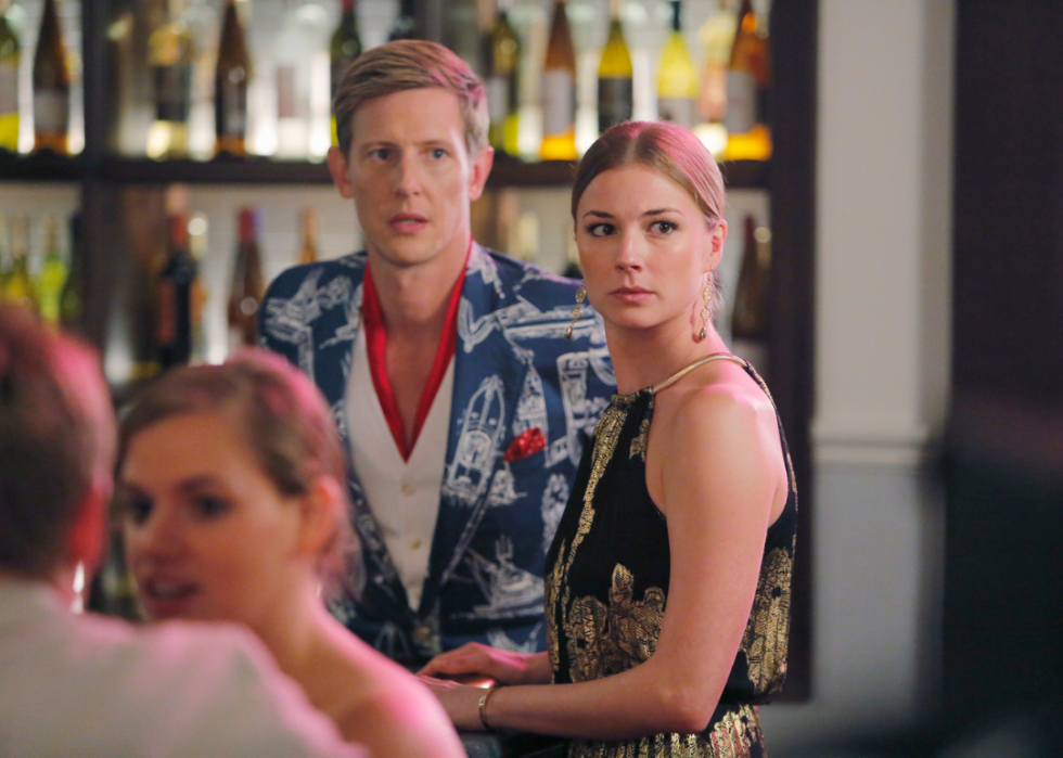 Gabriel Mann and Emily VanCamp at a bar.