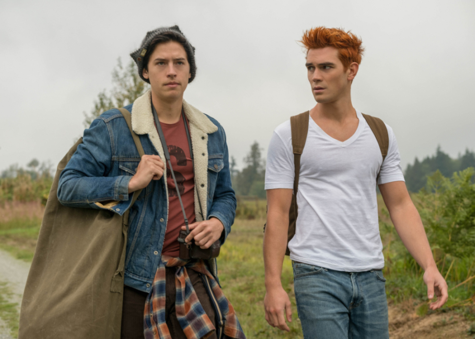 Cole Sprouse and KJ Apa walking.