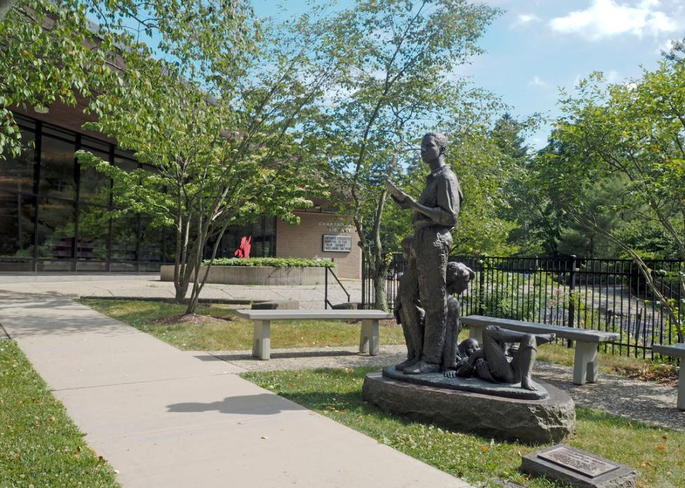 Chappaqua public library building and sculpture.