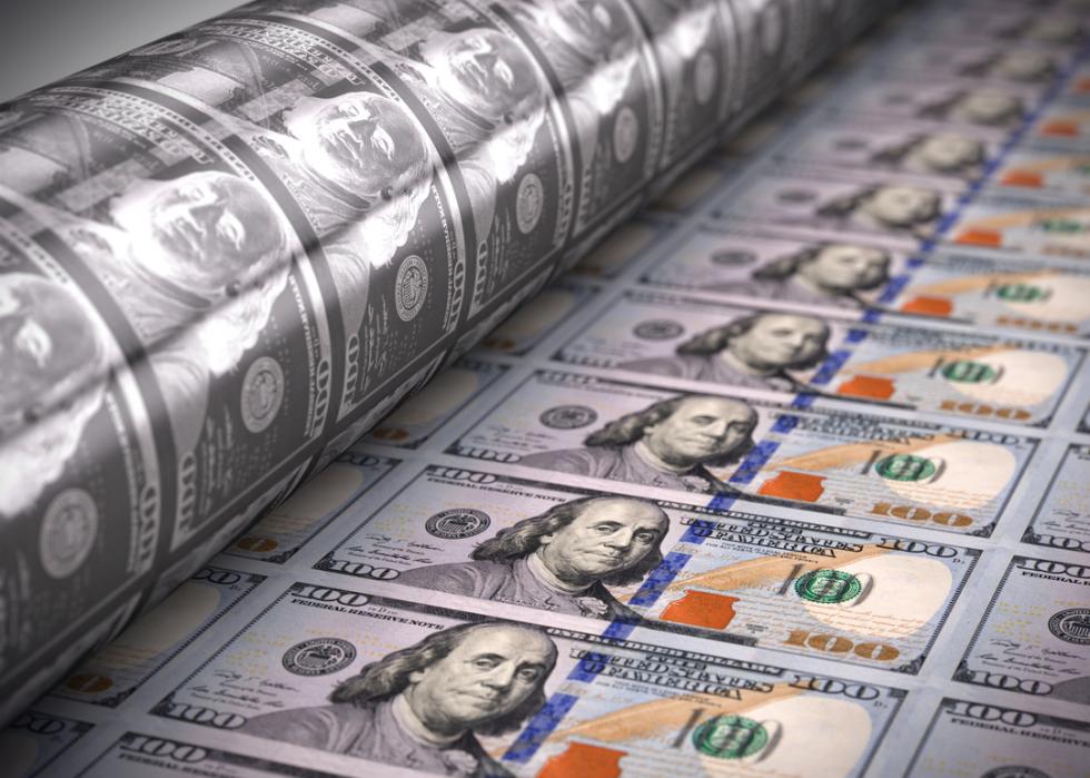 A machine printing $100 bills