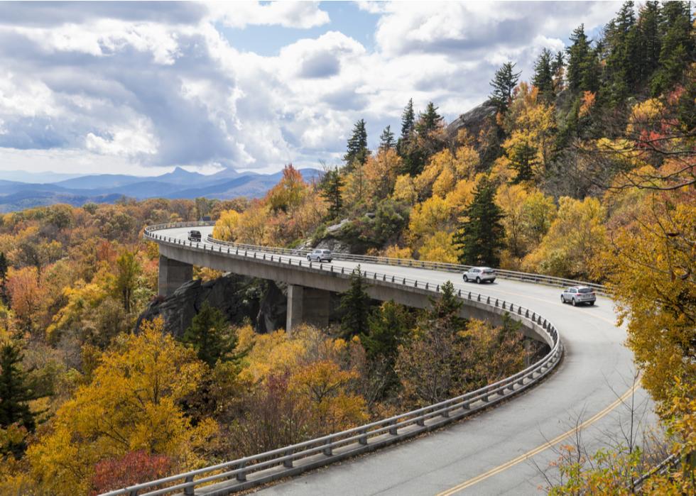Cars driving over Linn Cove Viaduct, Blue Ridge Parkway in North Carolina