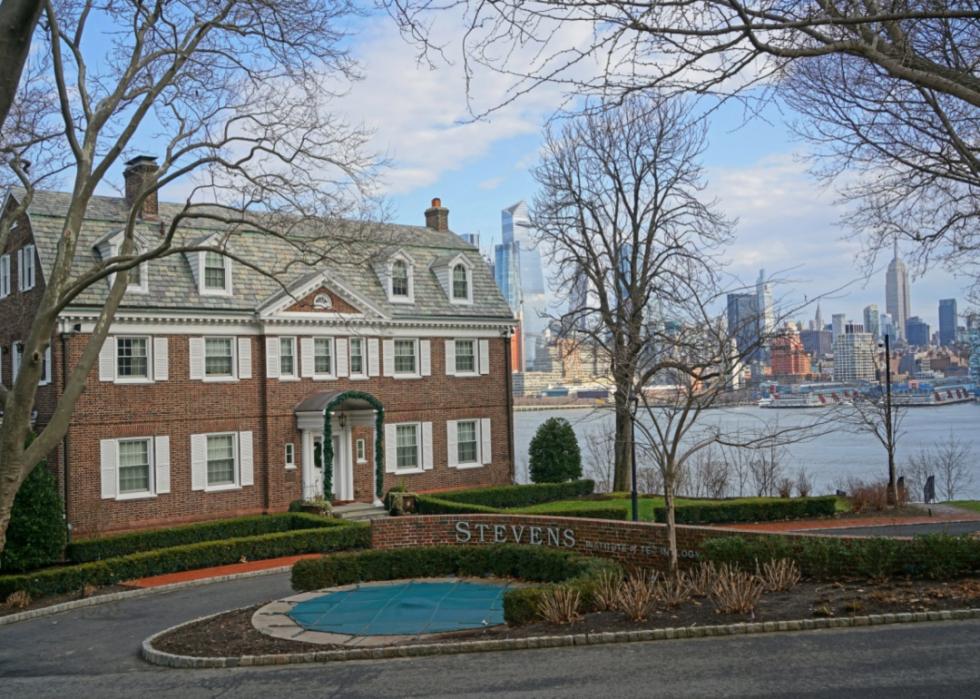 A historic building in front of the Hudson River on the Stevens Institute campus.