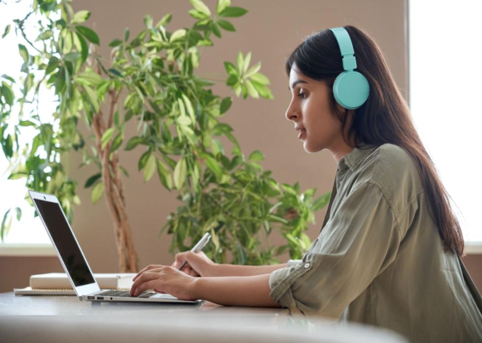 A young woman on a laptop.