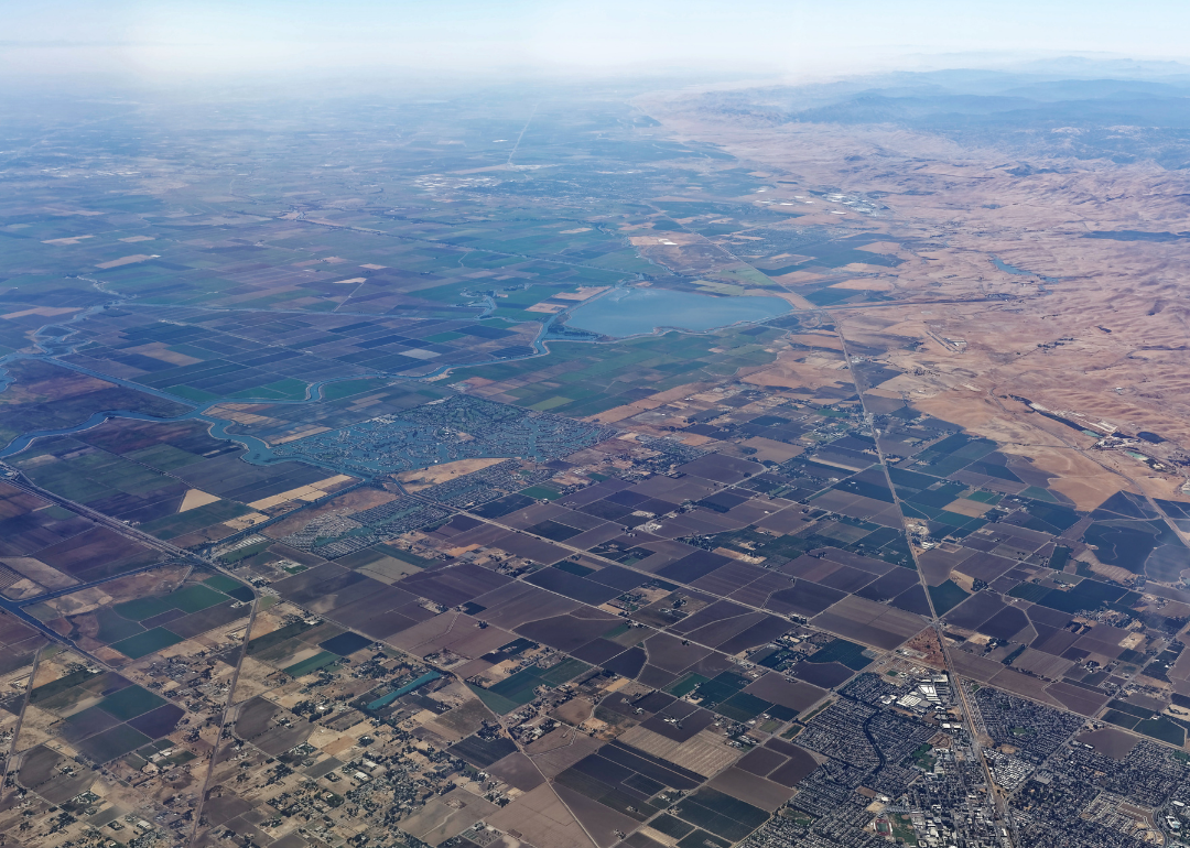 A view of hazy skies over farmland.