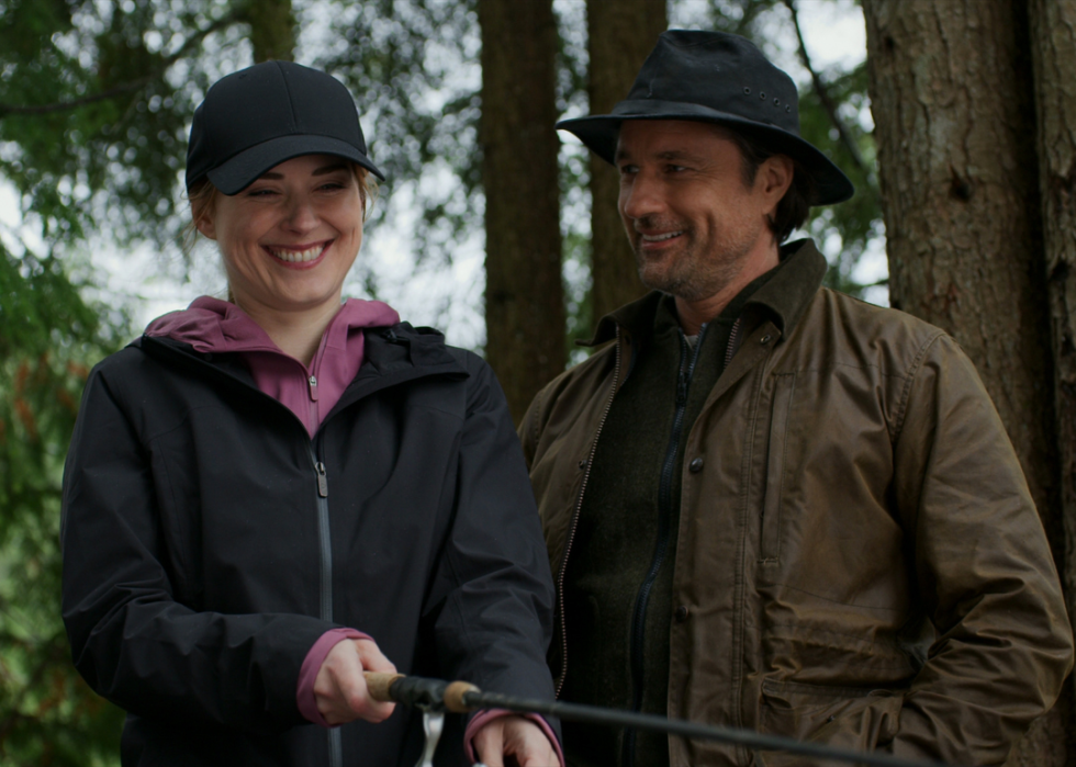 Martin Henderson and Alexandra Breckenridge fishing.