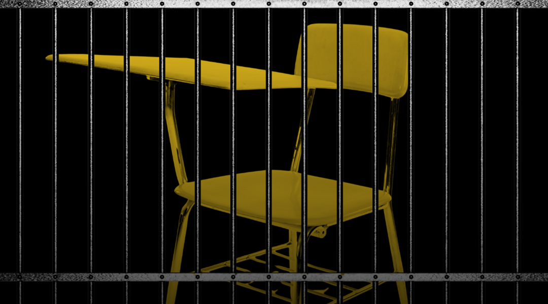A school chair behind bars.