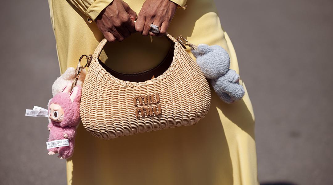 Zufi Alexander's straw Miu Miu bag attached with Labubu charms.