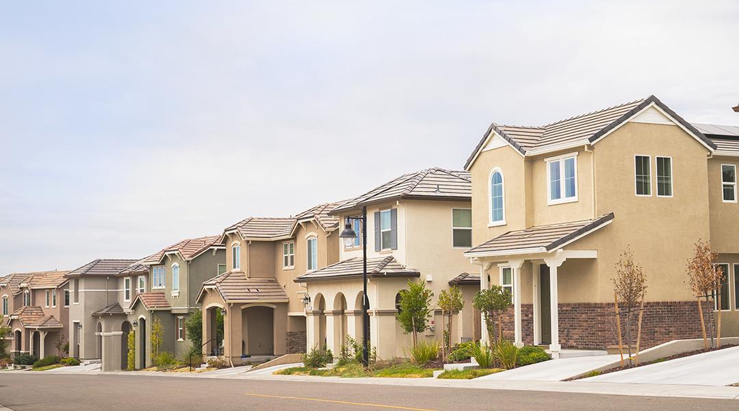 A row of double story suburban homes.