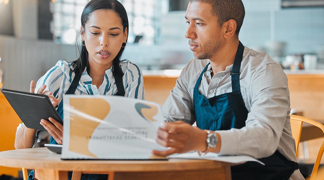 Cafe small business owners planning budget and other business concerns.
