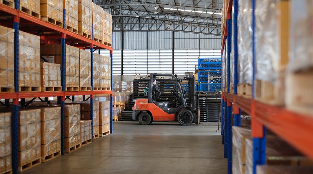 Interior of a modern auto parts factory or warehouse.