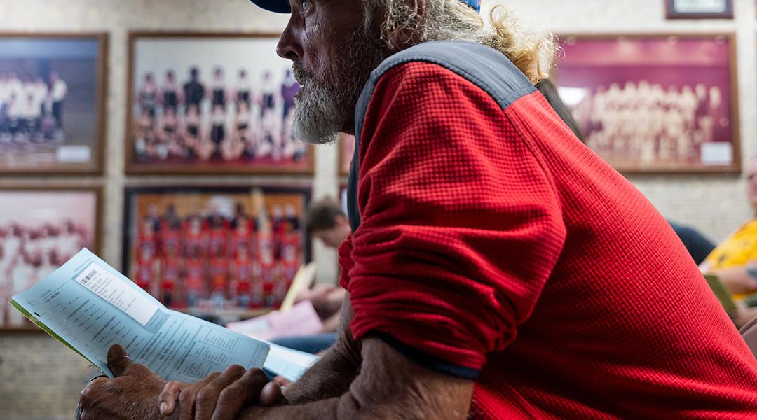 A patient waits to take a vision test for a new pair of glasses at a Remote Area Medical (RAM) mobile dental and medical clinic at Terre Haute South High School, Indiana.