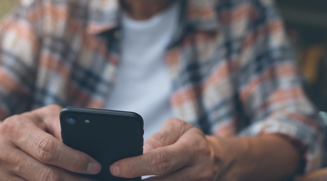A man using a smartphone.