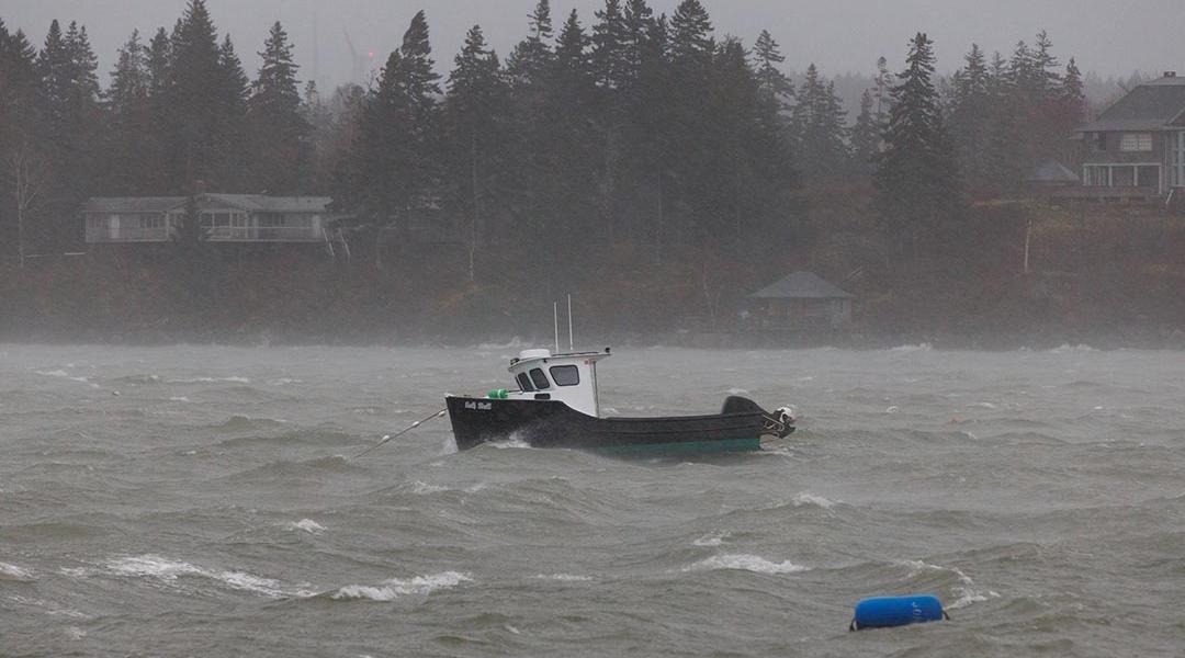 A lobster boat at sea during a storm in the North Haven Harbor, Maine.