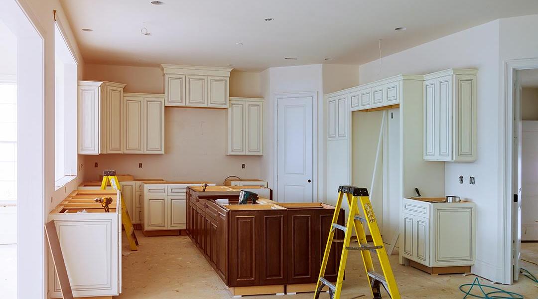 New cabinet installment in progress for a modern kitchen.